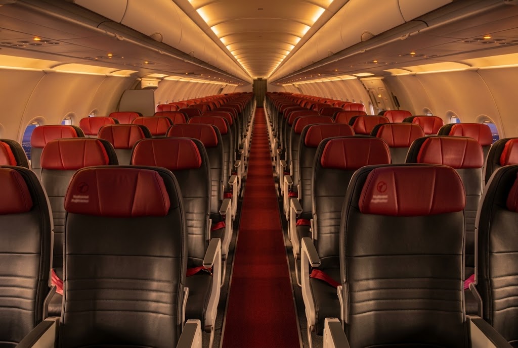 Air Canada Rouge A321 economy cabin looking down the aisle
