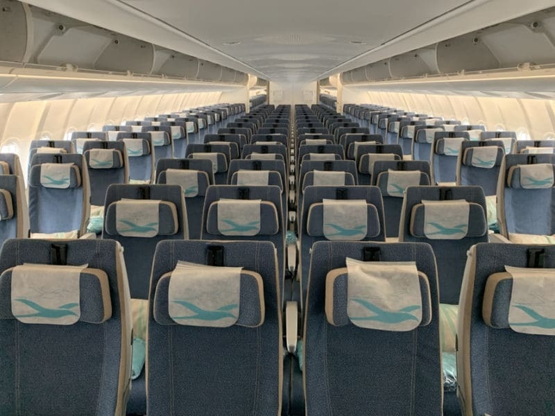 Air Mauritius A330-900neo economy cabin with blue 2-4-2 seats and tropicbird headrest covers