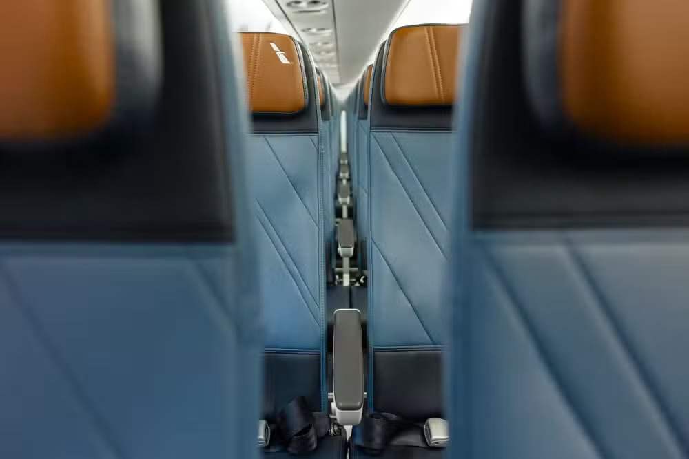 New-generation Recaro slimline seats in the main cabin of an American Eagle Embraer 175, looking forward down the two-by-two cabin