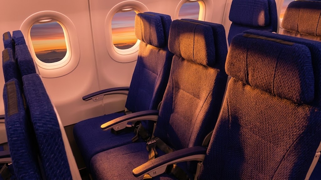 ANA Airbus A320neo economy seats in blue fabric beside the window line at sunset