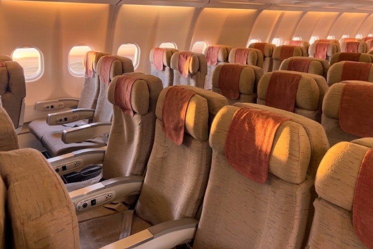 Asiana Airlines Airbus A330-300 business class cabin, paired recliner seats with centre consoles and armrest controls