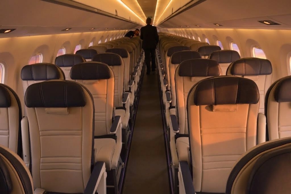 Azul Embraer cabin, two-by-two leather seating with no middle seat, looking down the aisle