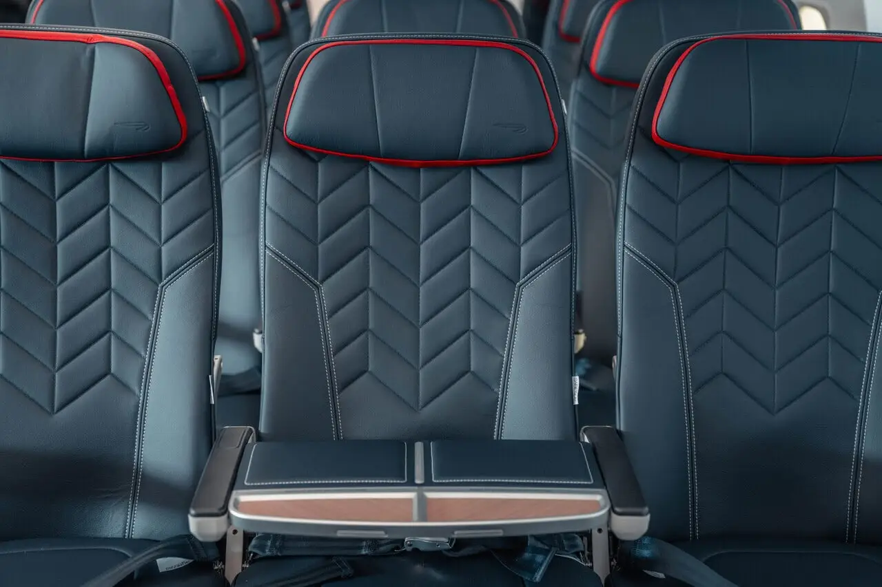 British Airways A320neo Euro Traveller economy seats with red BA headrest piping