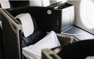 British Airways A350-1000 Club Suite business class seat with white bedding and premium cabin interior