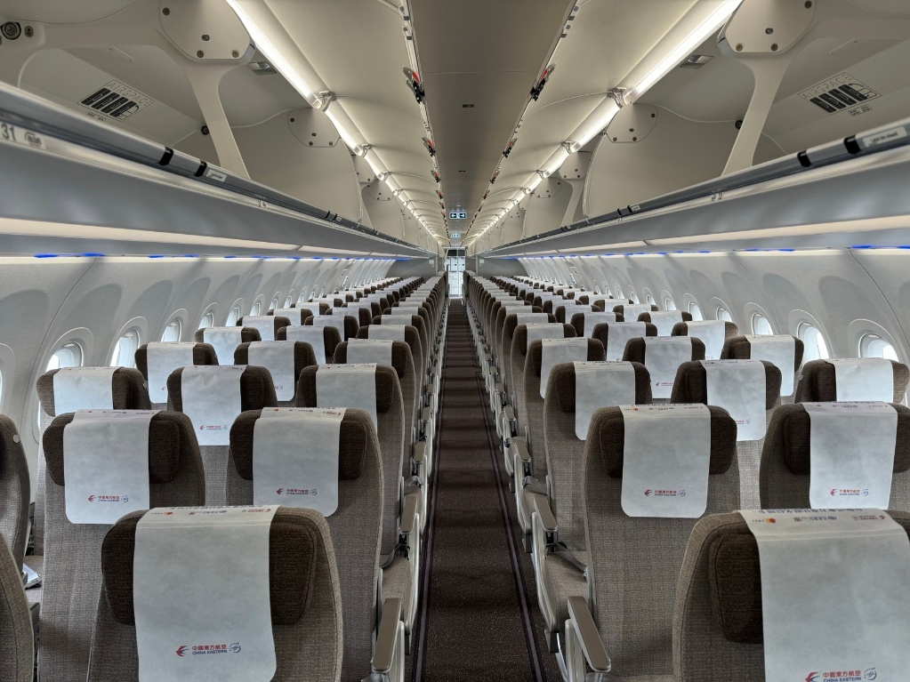 China Eastern Airbus A321neo economy cabin looking aft along the three-by-three seating