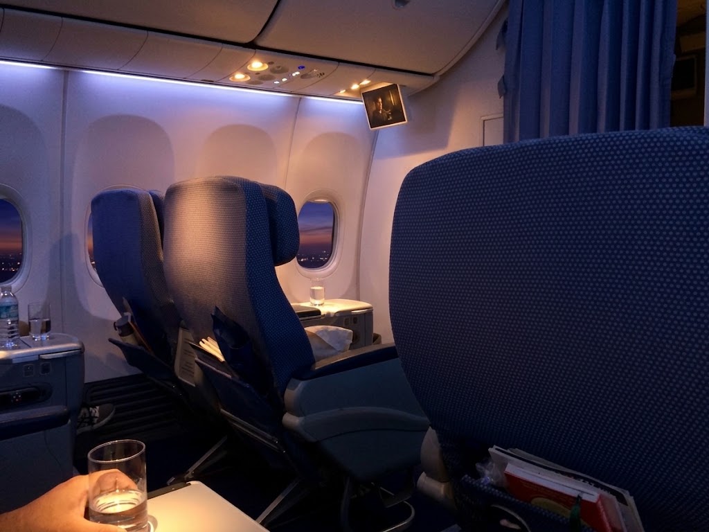China Southern Boeing 737-800 forward cabin, blue two-abreast seating with the cabin curtain drawn behind