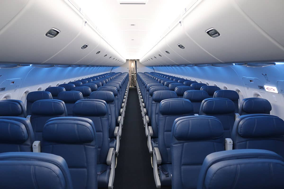 Delta Air Lines A319 Main Cabin interior with blue leather seats