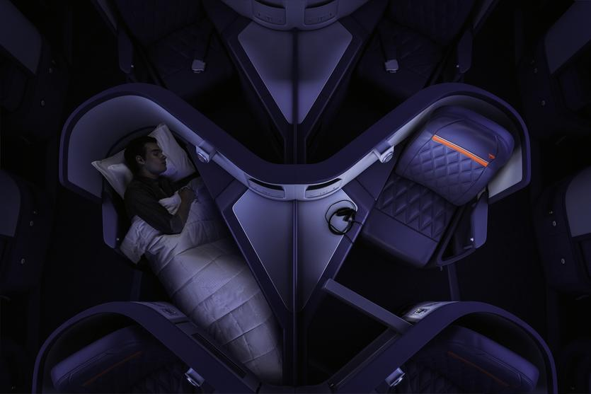 Delta One reverse herringbone lie-flat seats seen from above, one made up as a bed