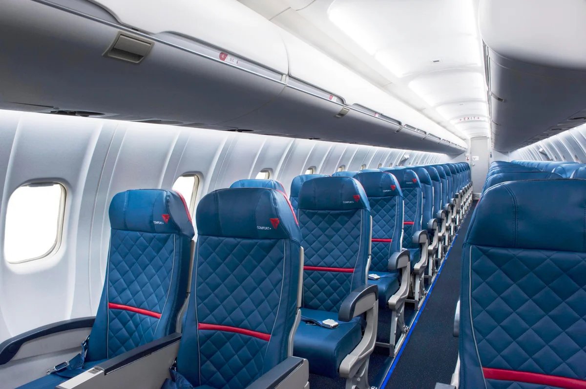 Delta CRJ-900 Comfort+ cabin with blue leather seats and red accent stripes