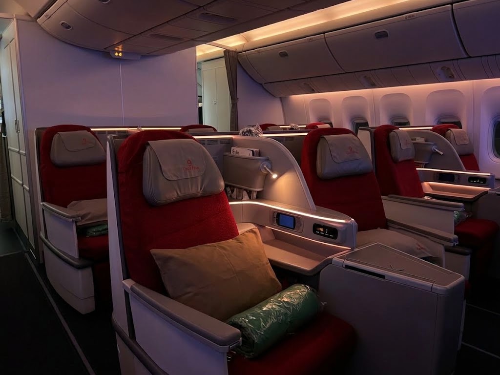 Ethiopian Airlines Cloud Nine business cabin, red seats with grey headrest covers carrying the Ethiopian logo