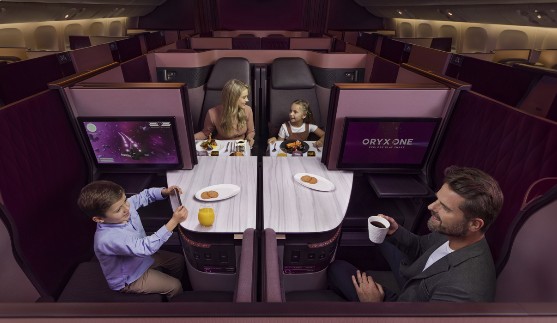 Family enjoying Qsuite business class seating