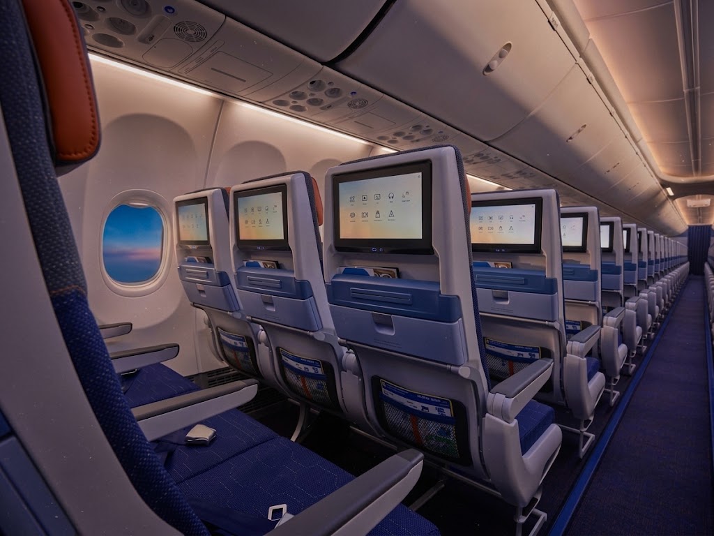 flydubai Boeing 737-800 economy cabin, three-by-three seating with seatback screens and the Boeing Sky Interior