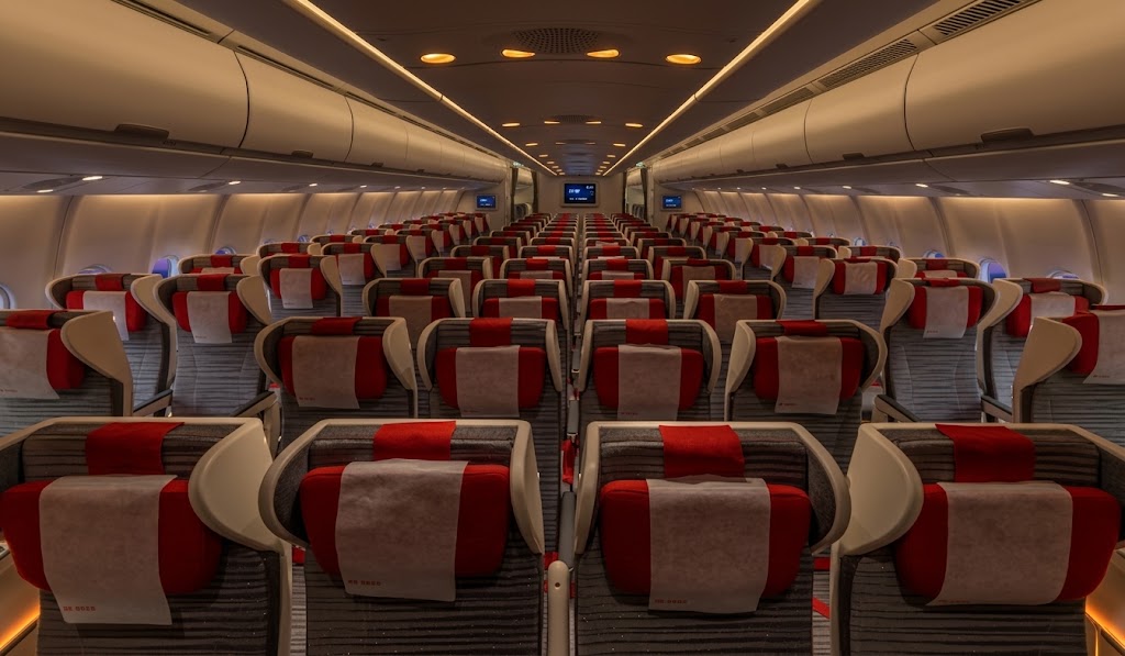 Hainan Airlines widebody economy cabin in red and grey
