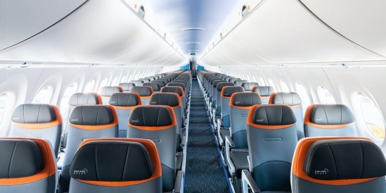 JetBlue A220-300 cabin interior showing 2-3 seat layout with seatback IFE screens