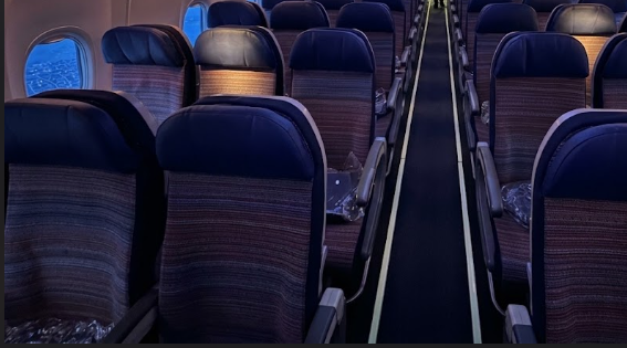 Korean Air Boeing 737-900 economy cabin looking aft along the three-by-three seating