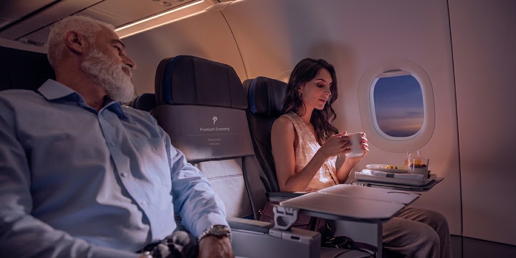 LATAM Airbus A321neo Premium Economy, two passengers seated either side of a blocked centre seat