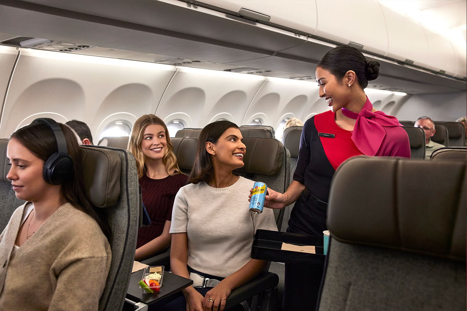 Qantas A321XLR Economy cabin interior with cabin crew serving passengers