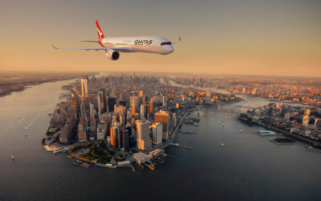 Qantas Airbus A350 in flight over Manhattan, representing the planned non-stop Sydney to New York service
