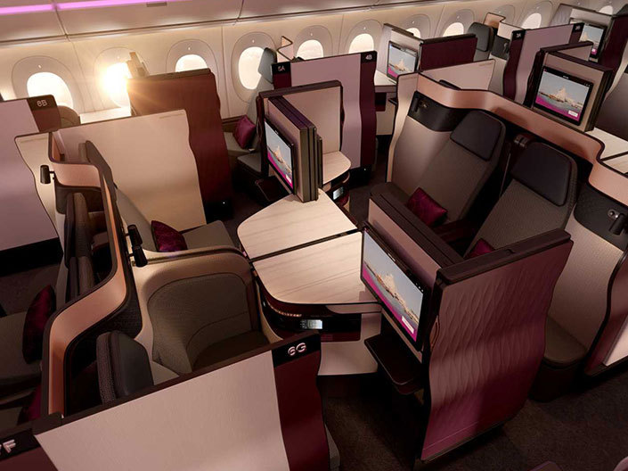 Qatar Airways A350-900 Qsuite Business Class cabin showing staggered suites with privacy doors