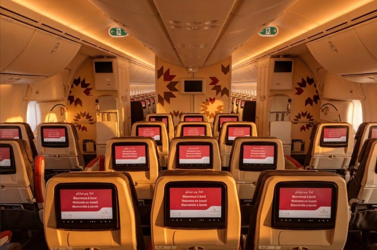 Royal Air Maroc Dreamliner economy cabin with seatback screens and Moroccan-pattern bulkheads