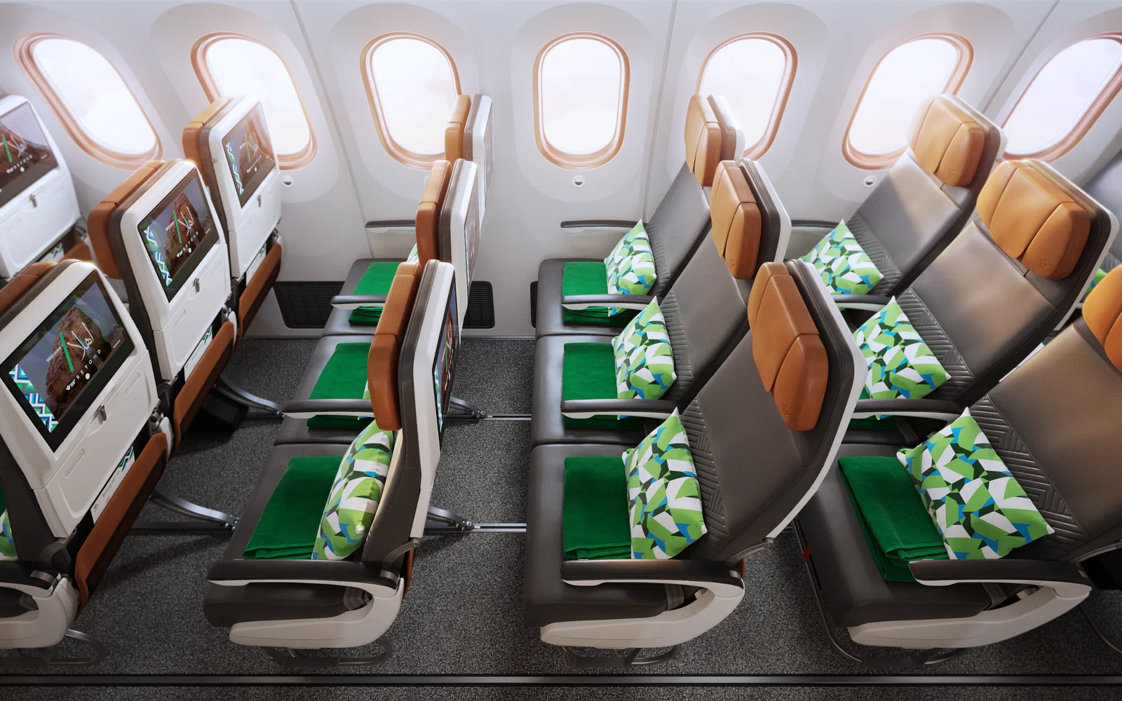Saudia Airbus A321neo economy cabin in 3-3 layout with seatback IFE screens and signature green leather and tan accents