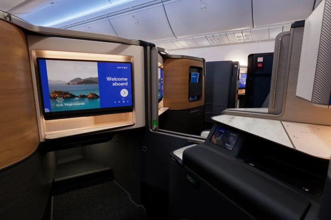 United Polaris suite with a door and a large seatback screen on the Elevated Boeing 787-9