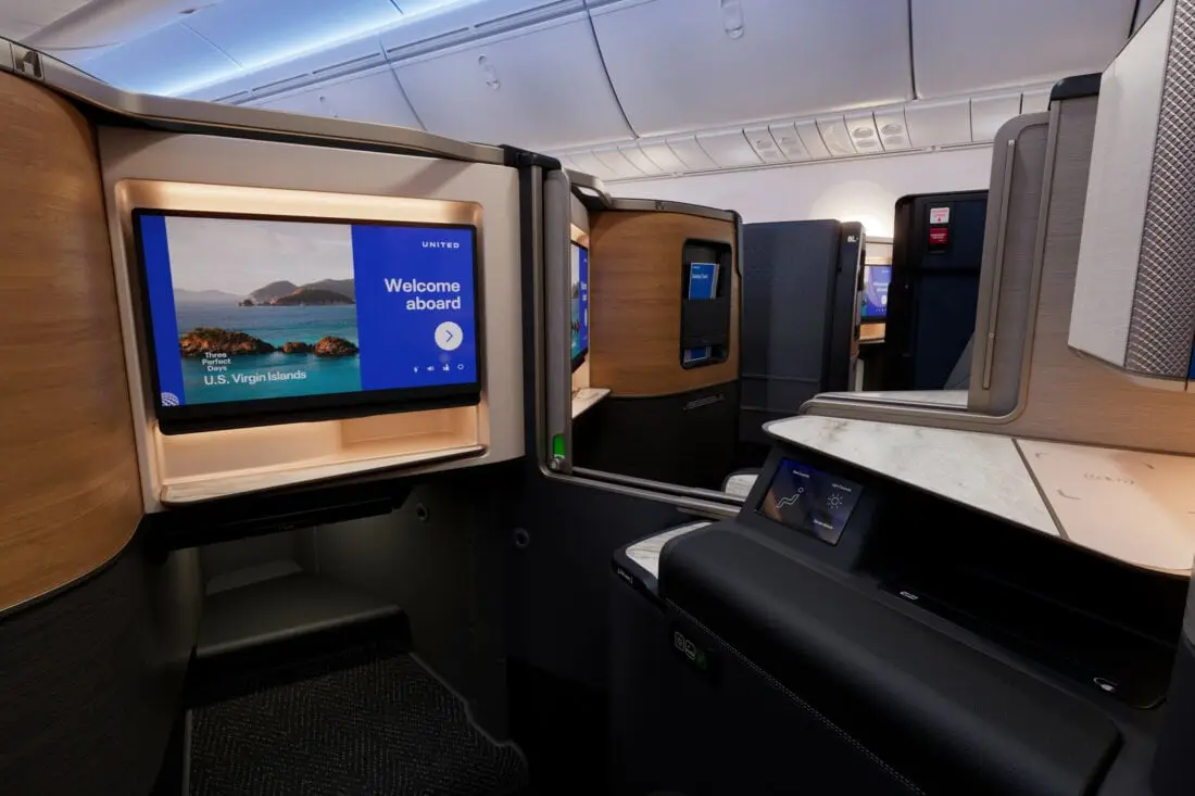United Airlines Polaris Studio suite on the Elevated 787-9 featuring doors and 27-inch screen