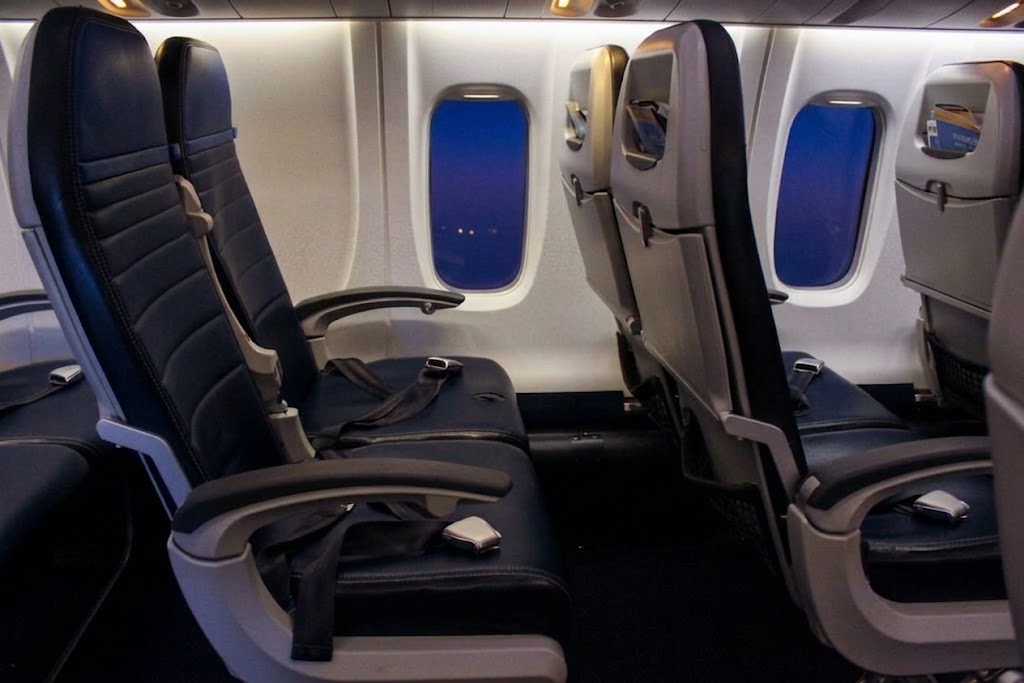 United Express CRJ-700 economy cabin looking forward along the 2-2 seating