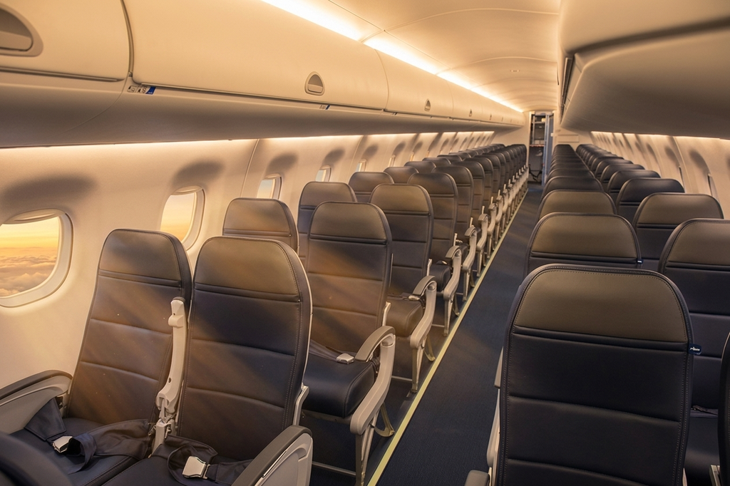 Alaska Airlines Embraer 175 Main Cabin looking down the aisle in 2-2 seating
