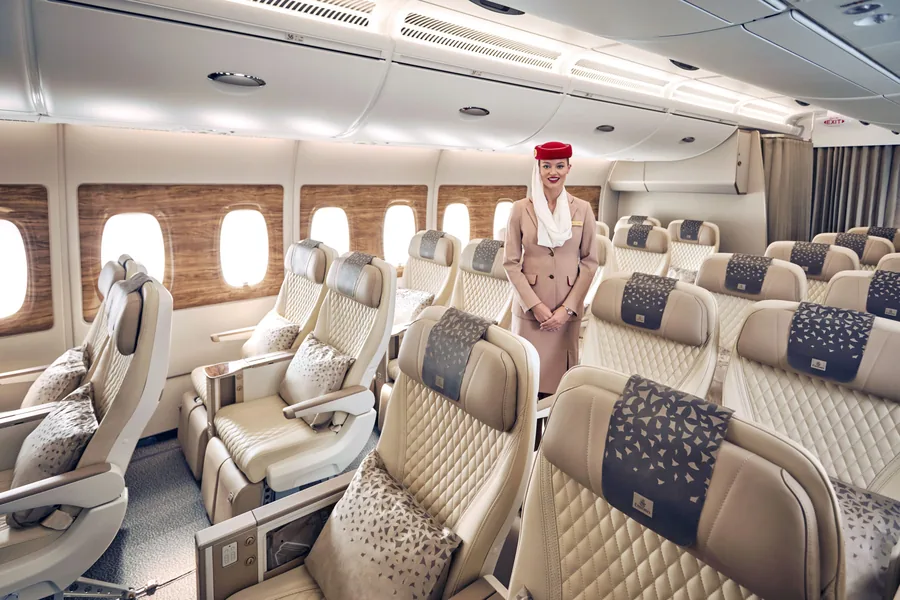 Emirates retrofitted Premium Economy cabin with cream leather seats and patterned headrests