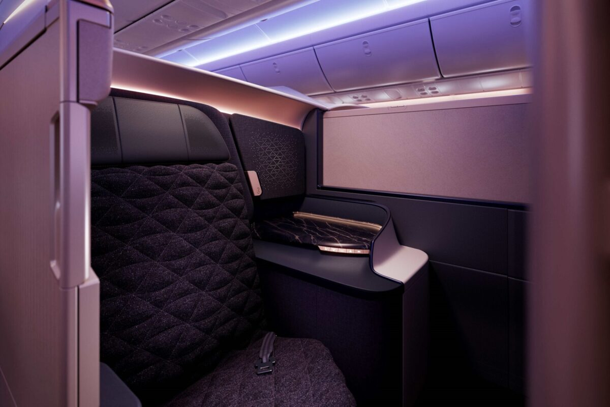 Riyadh Air Boeing 787-9 Business Class suite with quilted purple upholstery and mood lighting