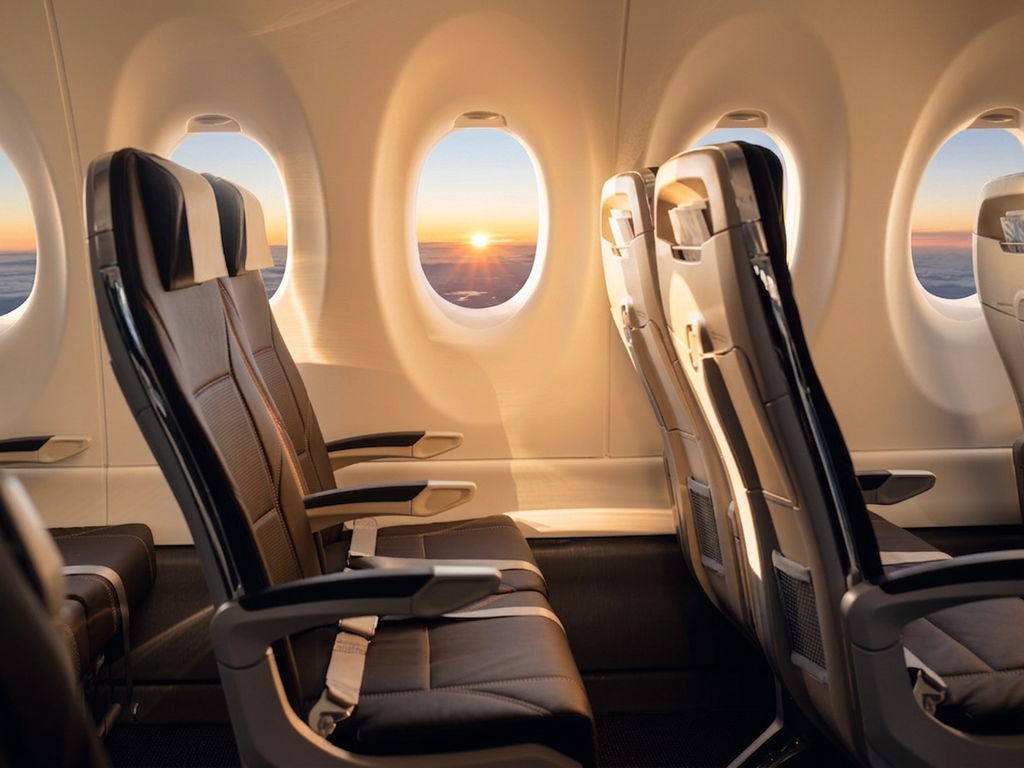 SWISS Airbus A220-300 economy cabin looking down the aisle in 2-3 seating