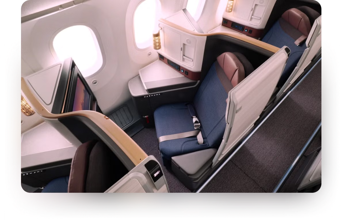 Air India Boeing 787 Elevate Ascent Business Class suite with blue upholstery and privacy dividers