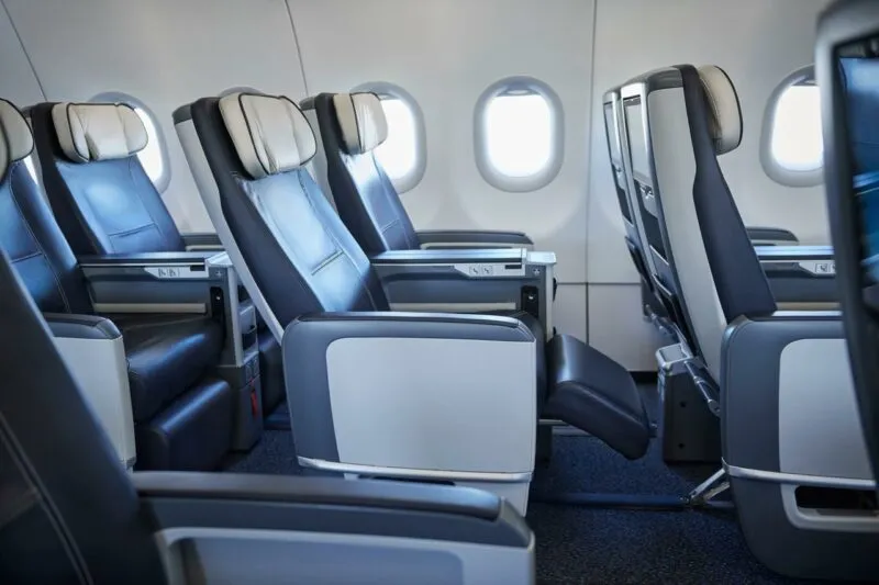 Air Transat A330 Club Class cabin with dark blue leather seats