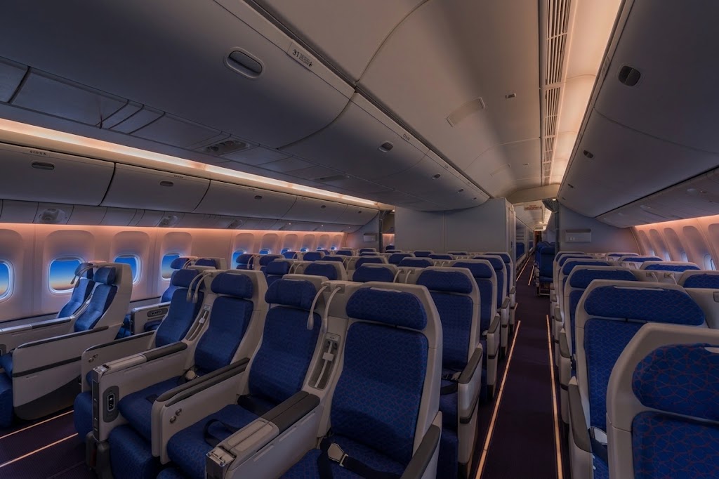China Southern Boeing 777-300ER Premium Economy cabin, 2-4-2 layout with blue seats and deployable legrests